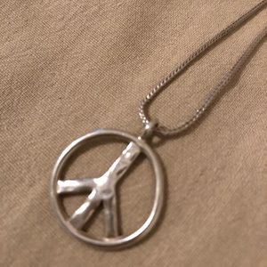 Silpada sterling silver peace sign necklace.
